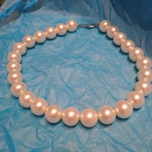 White pearl imitation necklace.
